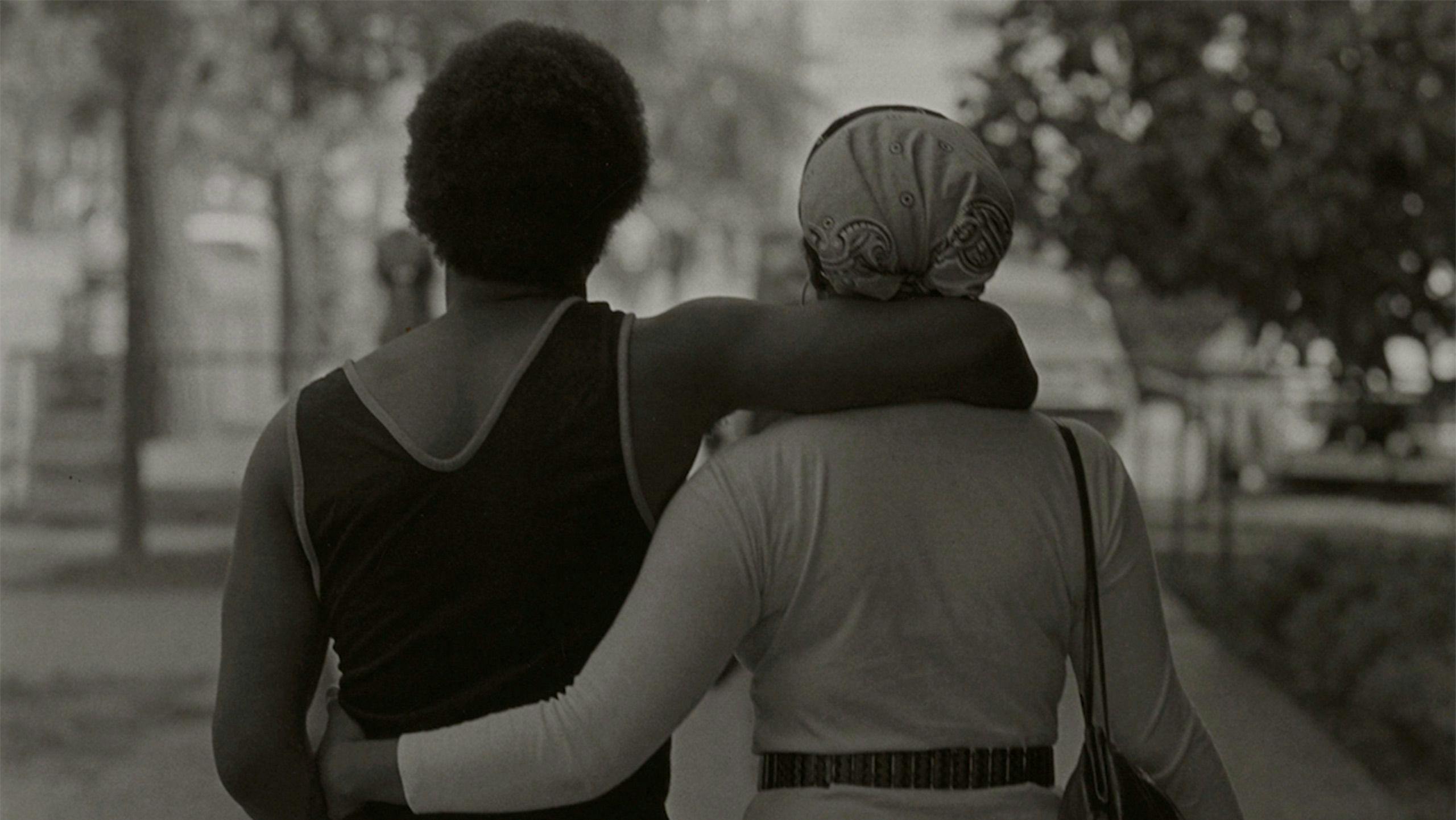A photograph by Roy DeCarava titled Couple Walking, dated 1979.